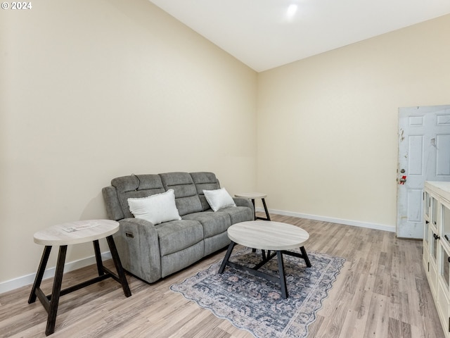 interior space featuring light wood finished floors and baseboards