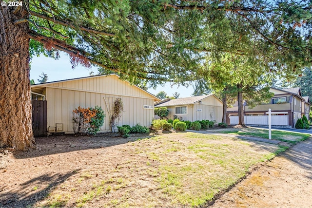 view of front facade with a front lawn and a garage