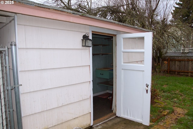 view of outbuilding with an outbuilding and fence