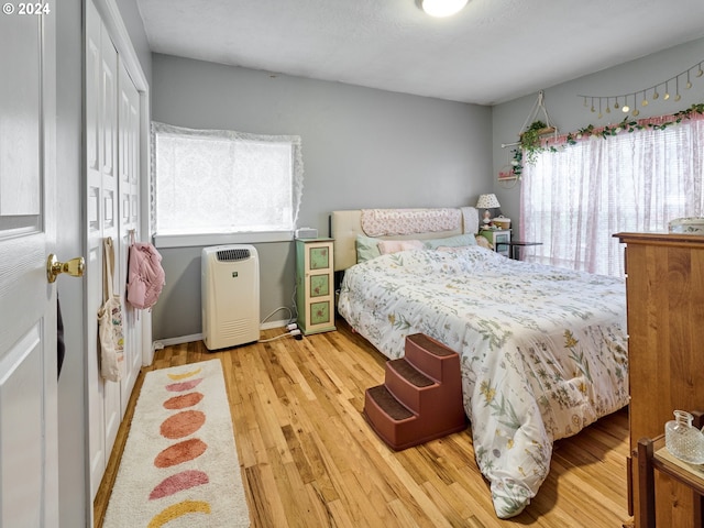 bedroom featuring a closet and light hardwood / wood-style flooring