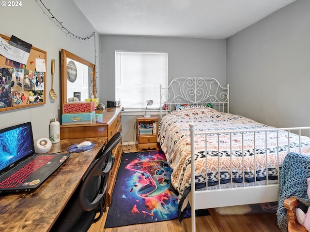 bedroom with light hardwood / wood-style flooring