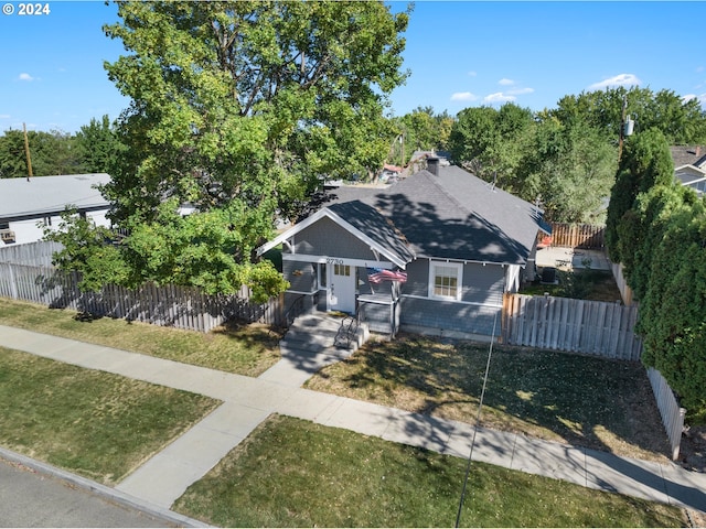 bungalow-style house featuring a front yard