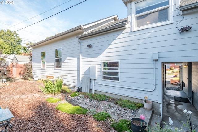 view of property exterior with a patio