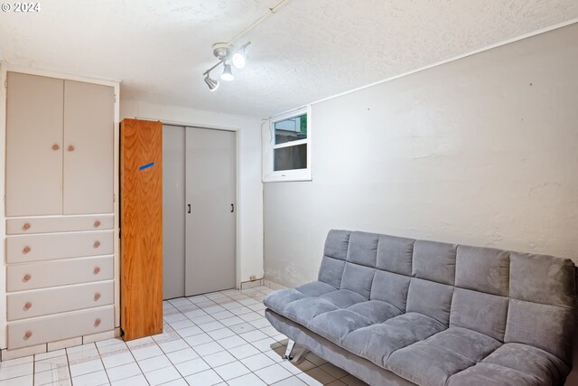 2405 Maple St, Longview, WA 98632 - living area featuring light tile patterned floors and a textured ceiling