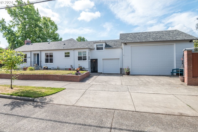 single story home featuring a garage