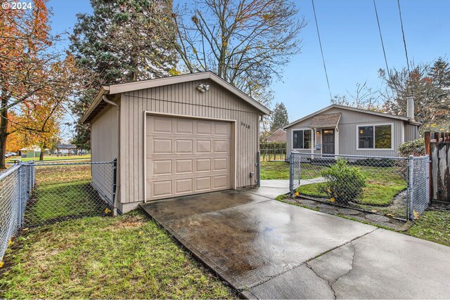 garage featuring a lawn