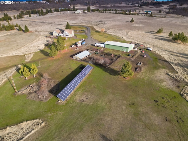 birds eye view of property with a rural view