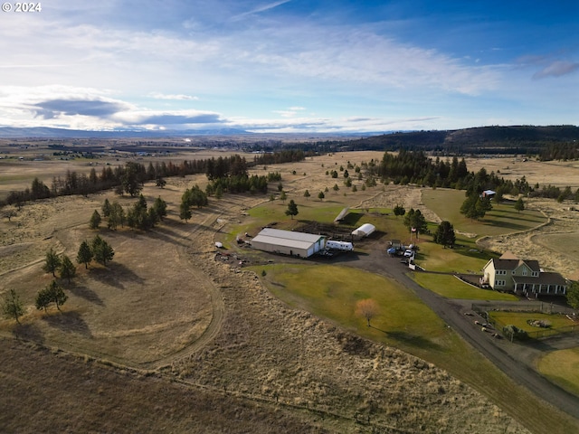 birds eye view of property featuring a rural view