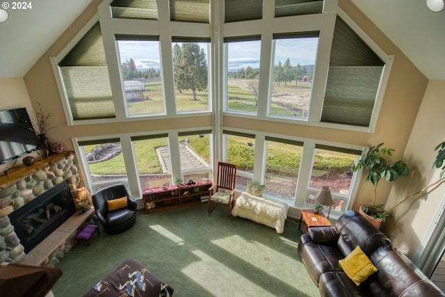 sunroom featuring a fireplace