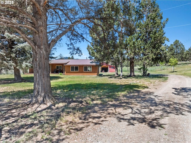 17943 Old Auburn Ln, Baker City, OR 97814 - ranch-style home with a front yard, metal roof, and dirt driveway