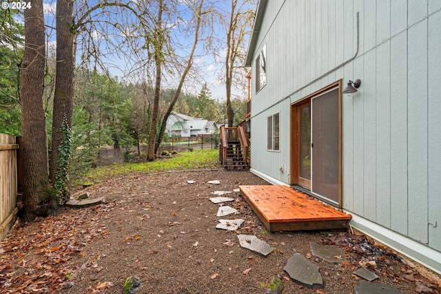 view of yard featuring stairs and a fenced backyard