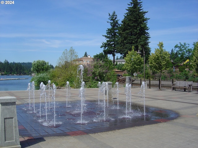 view of community with a water view