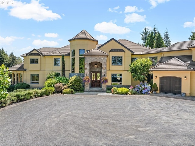 view of front facade with french doors and a garage