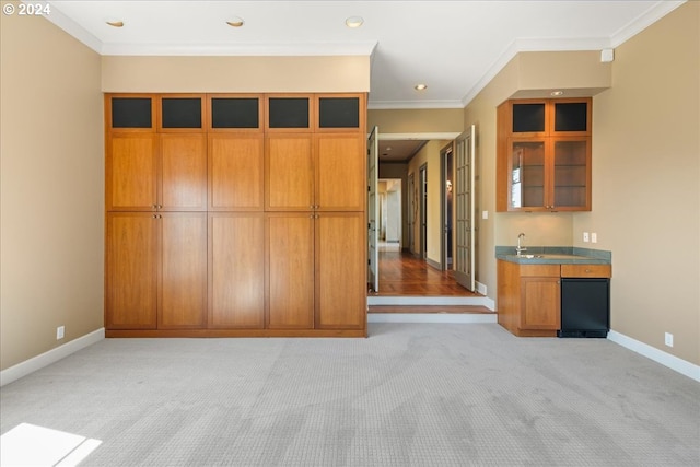 interior space featuring ornamental molding and light colored carpet