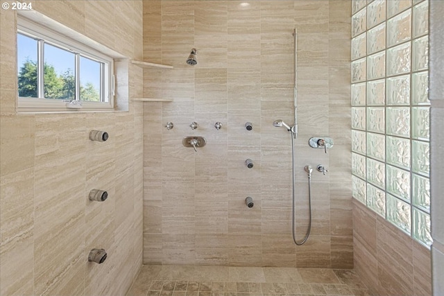 bathroom with tiled shower