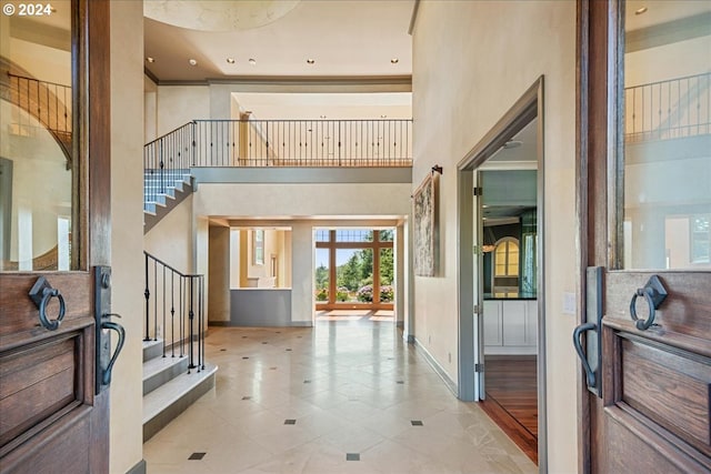 entrance foyer featuring light tile patterned flooring