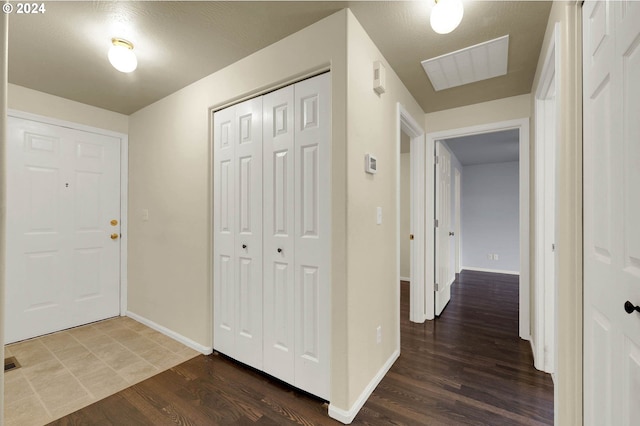 entrance foyer featuring dark wood-type flooring and a textured ceiling