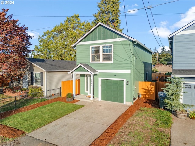 view of front facade with a front yard and a garage