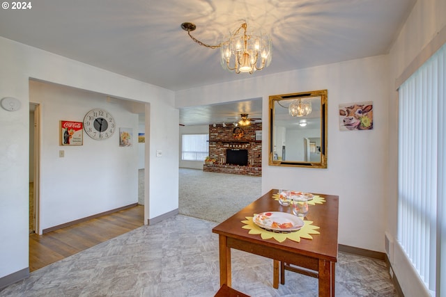 hall featuring carpet flooring and a notable chandelier