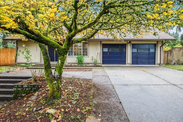 single story home with a garage