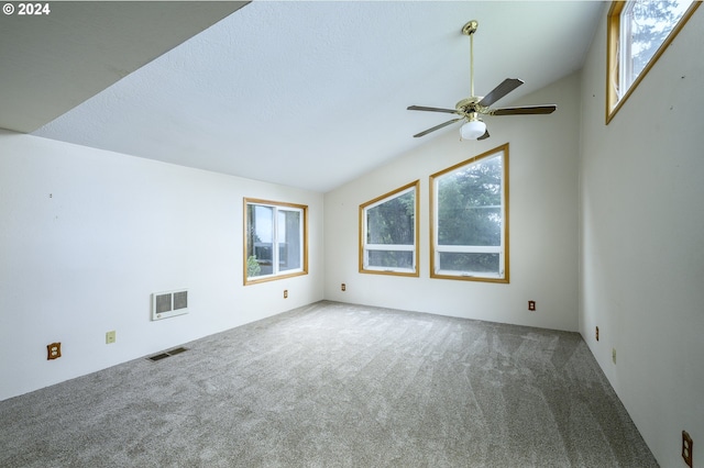 spare room with carpet floors, ceiling fan, and lofted ceiling