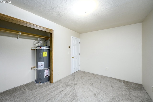 utility room with strapped water heater