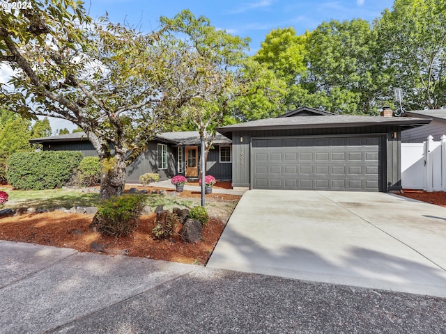 ranch-style house featuring a garage