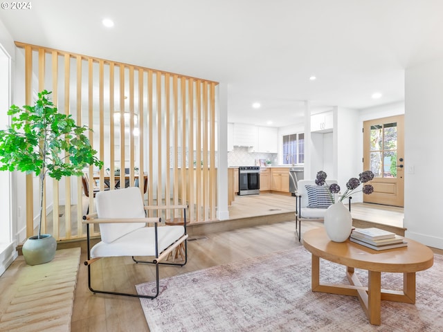 living room with light hardwood / wood-style flooring