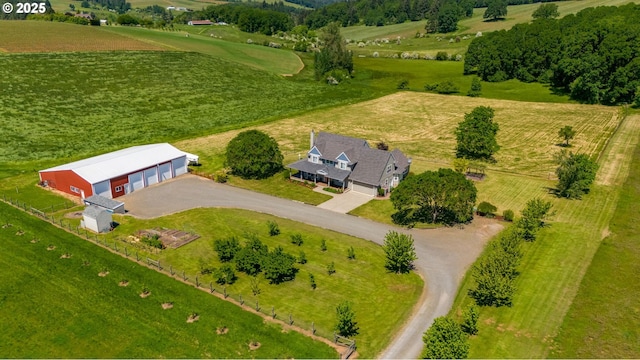birds eye view of property with a rural view