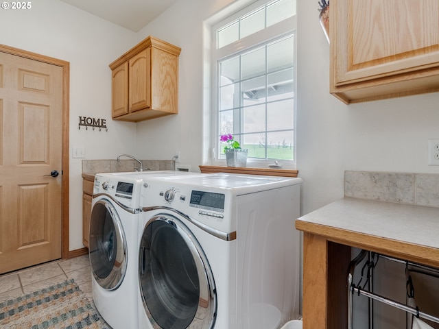 washroom with separate washer and dryer, light tile patterned floors, and cabinet space