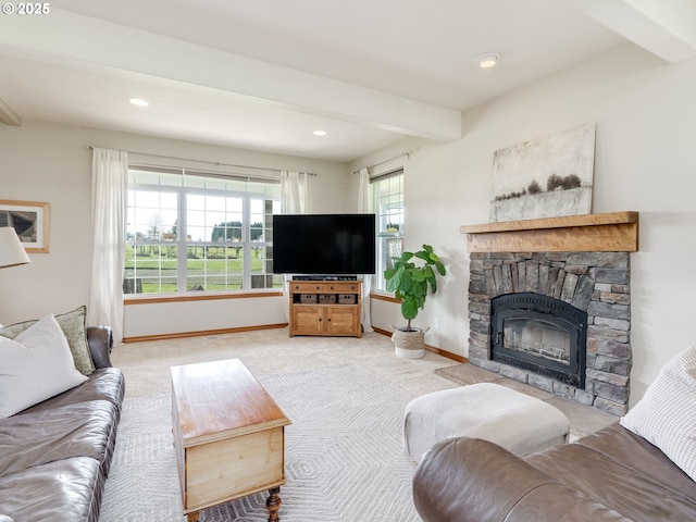 carpeted living room featuring a stone fireplace, beam ceiling, baseboards, and recessed lighting