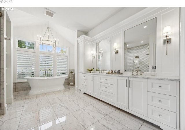 bathroom featuring plus walk in shower, vanity, a chandelier, and vaulted ceiling