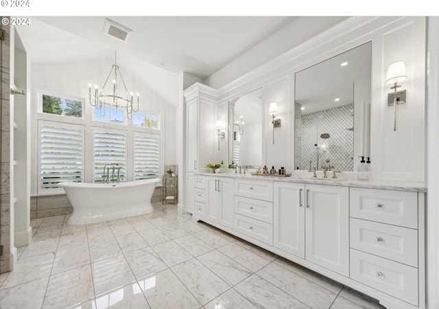 full bath featuring a tile shower, a soaking tub, double vanity, visible vents, and a notable chandelier
