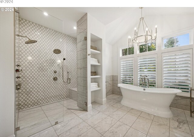 full bath featuring a shower stall, a chandelier, tile walls, a freestanding bath, and marble finish floor