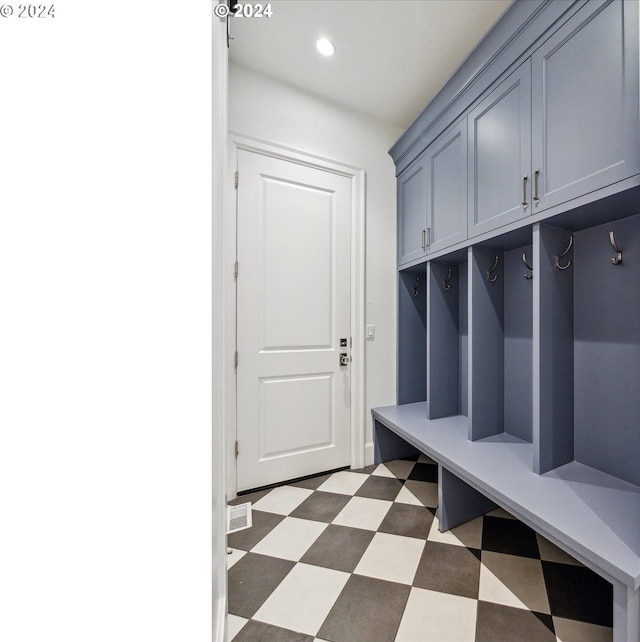 mudroom with recessed lighting and light floors