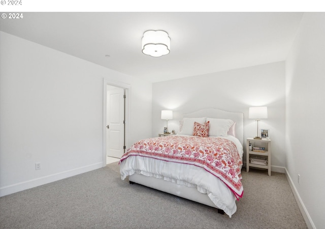 carpeted bedroom with baseboards