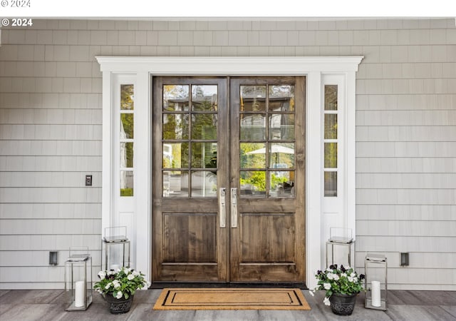 view of exterior entry featuring french doors