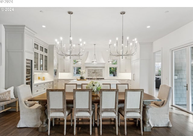 dining area featuring dark hardwood / wood-style floors and a notable chandelier