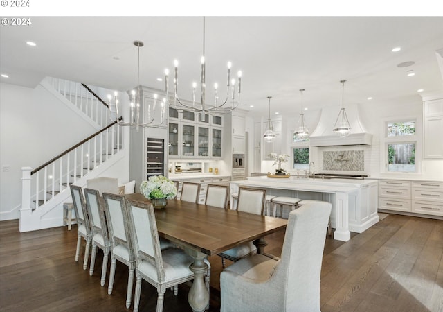 dining space featuring stairway, an inviting chandelier, dark wood-style flooring, and recessed lighting