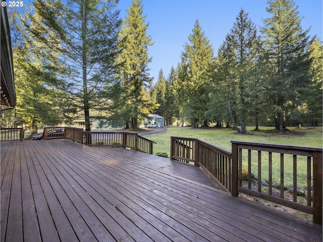 wooden terrace with a lawn