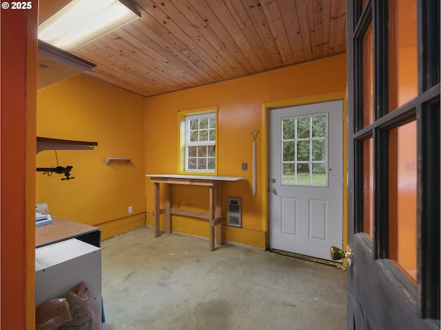 doorway with heating unit and wood ceiling