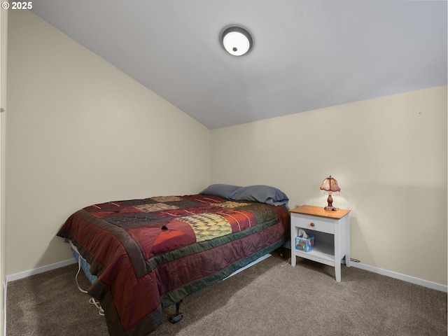 carpeted bedroom featuring lofted ceiling