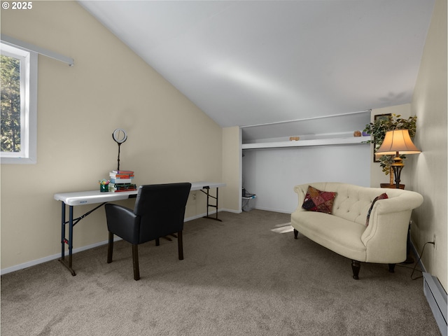 office area with a baseboard heating unit, vaulted ceiling, and light carpet