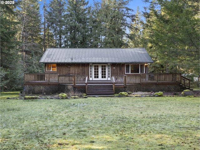 20480 E Lolo Pass Rd, Rhododendron, OR 97049 - view of front facade featuring a front lawn, french doors, metal roof, and a deck