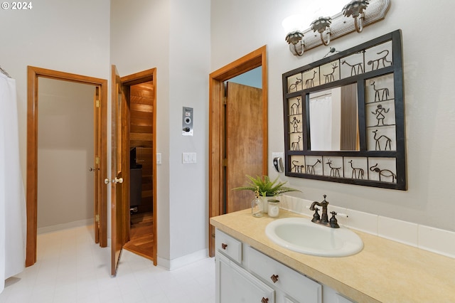 bathroom with tile patterned floors and vanity