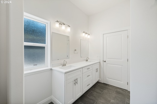 bathroom featuring plenty of natural light and vanity