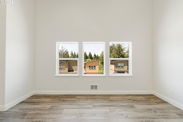 spare room featuring light hardwood / wood-style flooring