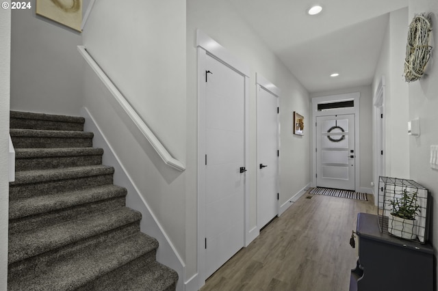 entryway with hardwood / wood-style flooring