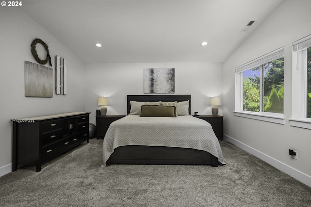 carpeted bedroom with vaulted ceiling