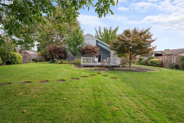 view of yard with a wooden deck